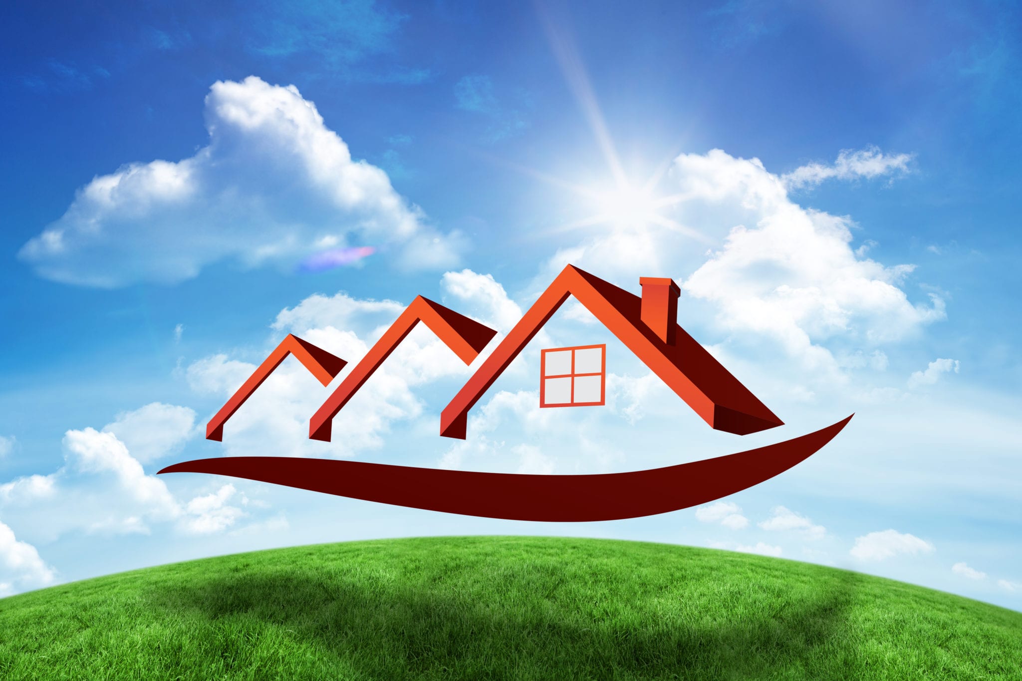 House roofs against green hill under blue sky