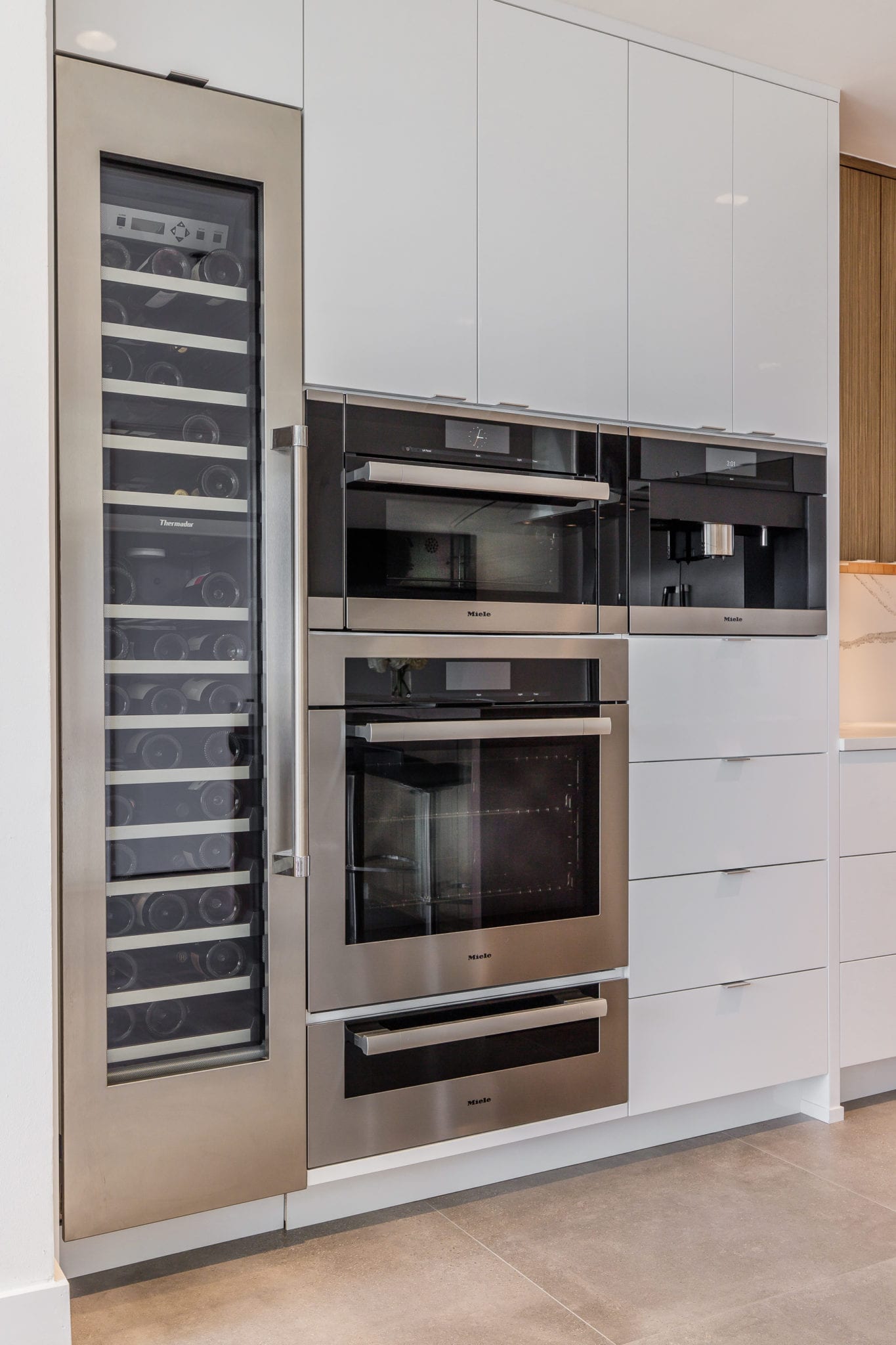 Renowned-Renovation-Penthouse-Kitchen-Remodel-Custom-Cabinets-Miele-Appliances-Cambria-Countertop-Kohler-Fixtures-Dallas-75205