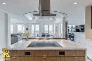 Kitchen Island in Dallas TX Penthouse After Remodeling by Renowned Renovation in The Travis at Katy Trail