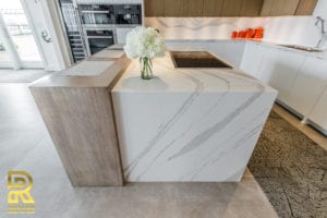 Kitchen Island in Dallas TX Penthouse After Remodeling by Renowned Renovation in The Travis at Katy Trail