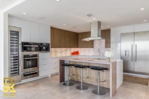 Kitchen Island in Dallas TX Penthouse After Remodeling by Renowned Renovation in The Travis at Katy Trail