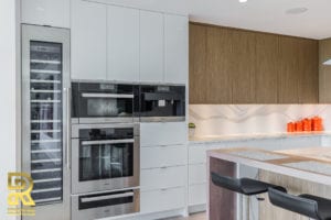 Kitchen Island in Dallas TX Penthouse After Remodeling by Renowned Renovation in The Travis at Katy Trail