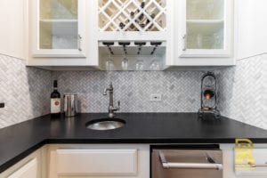 Wet Bar with Wine Rack in Highpark TX Single Family Home after Remodeling by Renowned Renovation
