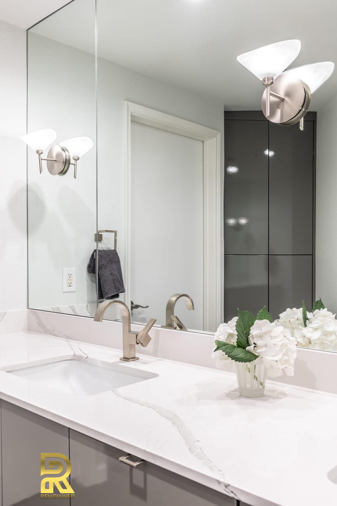 Cambria-Britannica-Quartz-Countertop-in-Soft-Modern-Master-Bath-remodeled-by-Renowned-Renovation-Dallas-TX-The Travis Soft Modern Master Bath Remodeling Sconce Idea