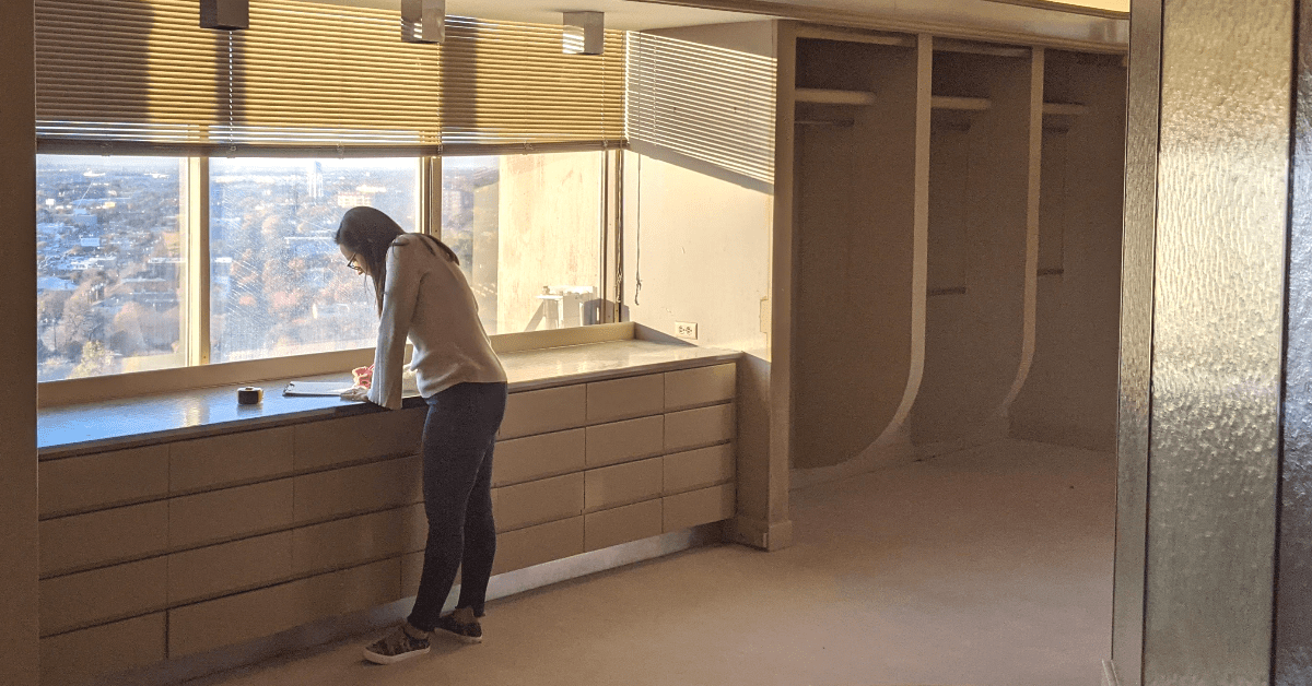 A Renowned Group Designee working on plans for a Dallas High-Rise Condo