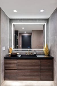 Close-up of guest bathroom vanity with no-hardware design by StyleCraft Cabinets, TX.