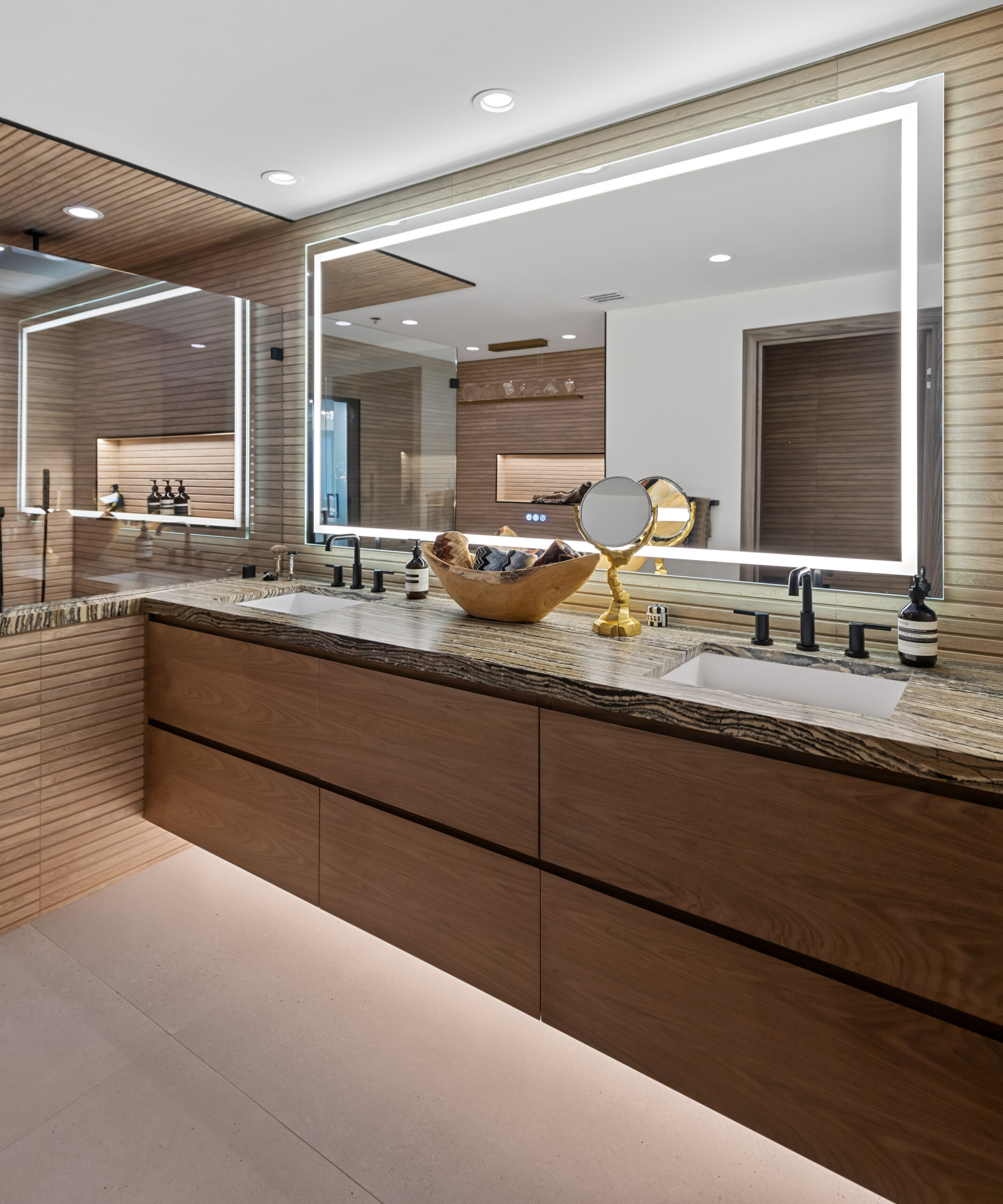 Contemporary master bathroom vanity with stone countertop and wood cabinetry by StyleCraft Cabinets, Texas.