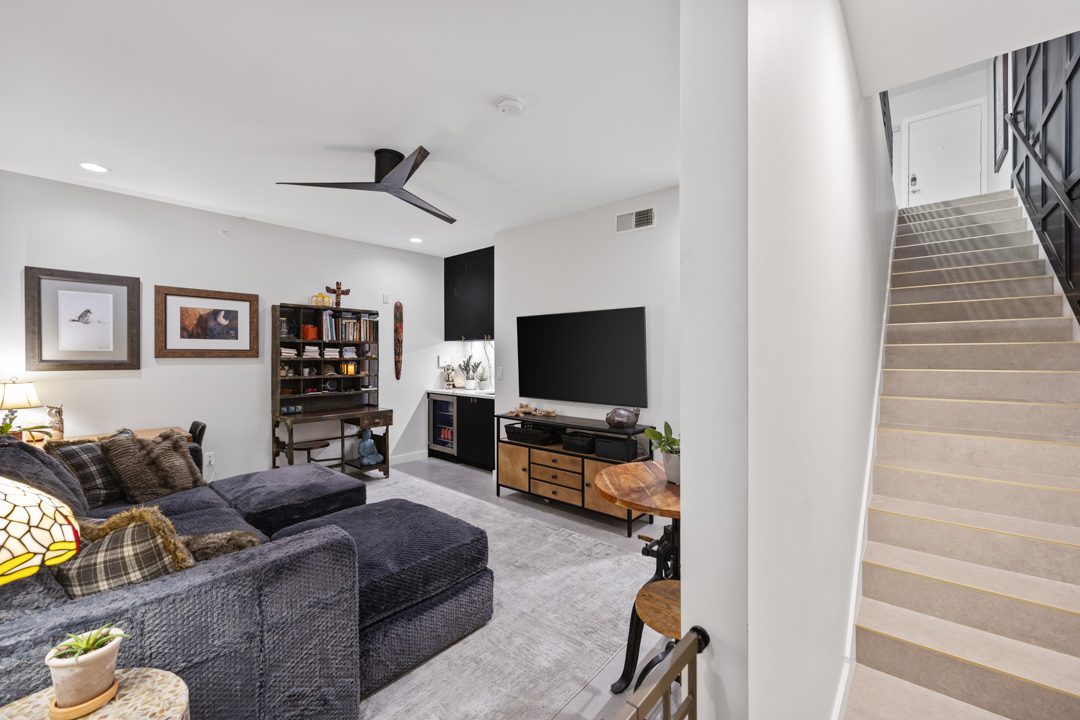 guest area TV room after Conversionn of a Downtown Dallas Condo by Renowned Group