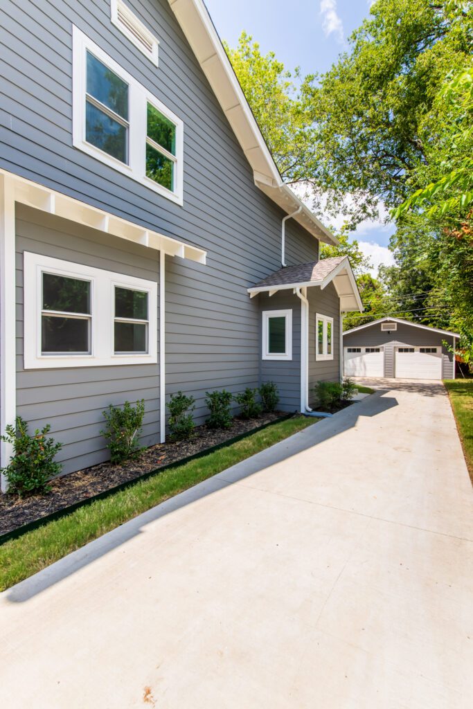 Renowned Group Dallas Custom Home Side Exterior Windows Landscaping